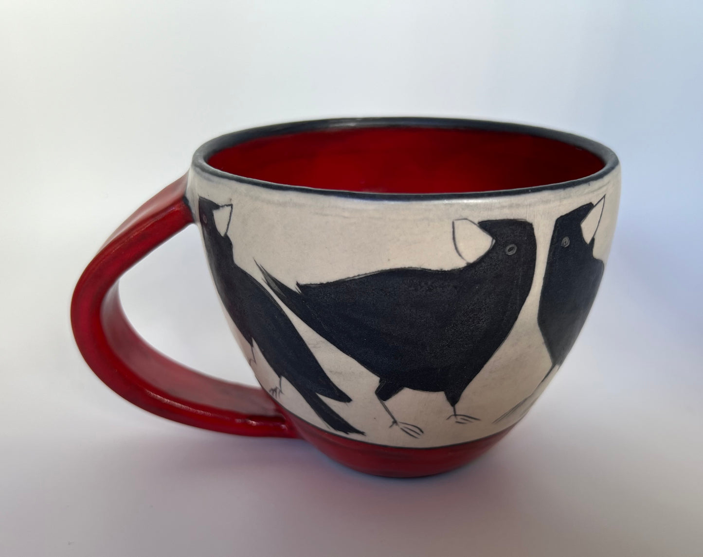 Crow on Latte cup by Sally Jaffee