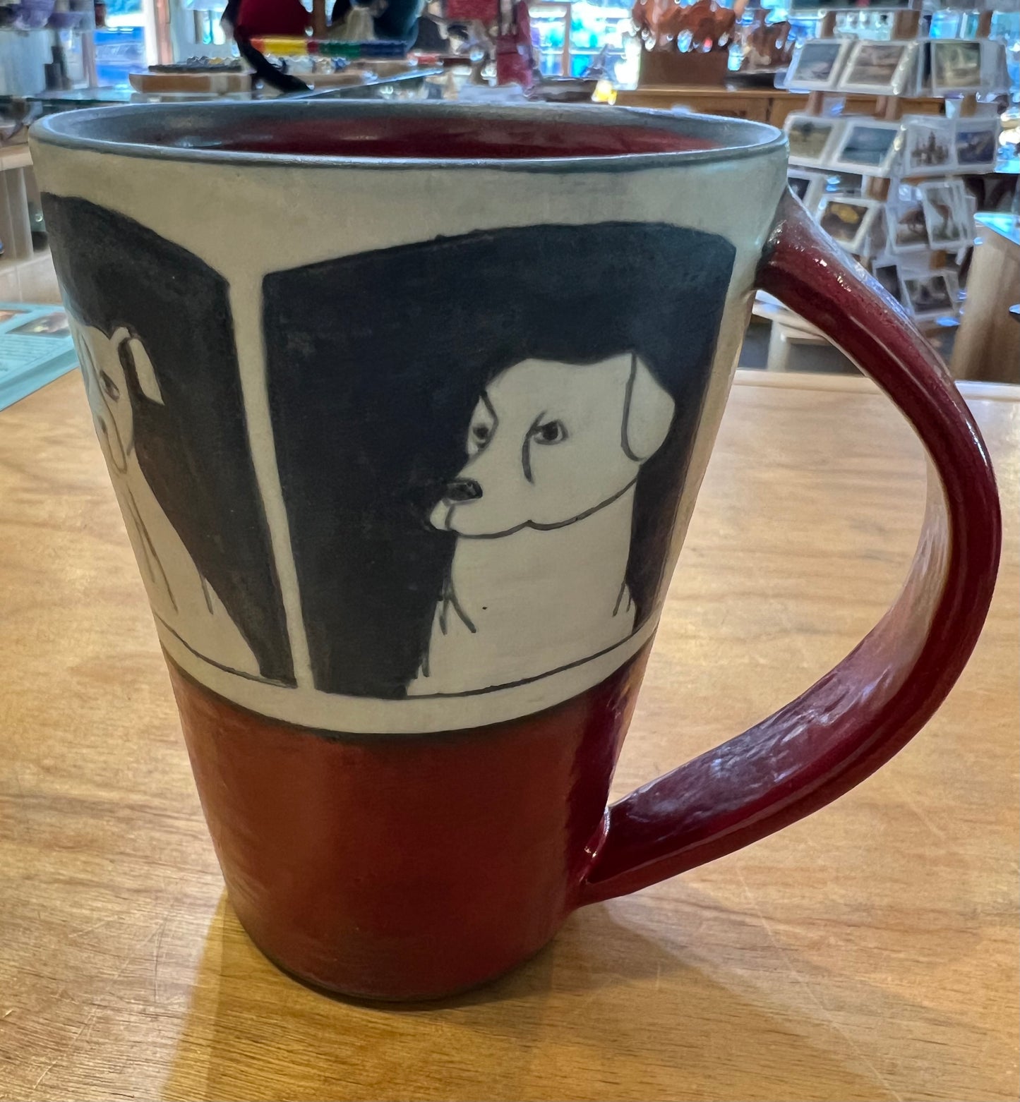 Dogs on Coffee Cup 4 1/2” by Sally Jaffee