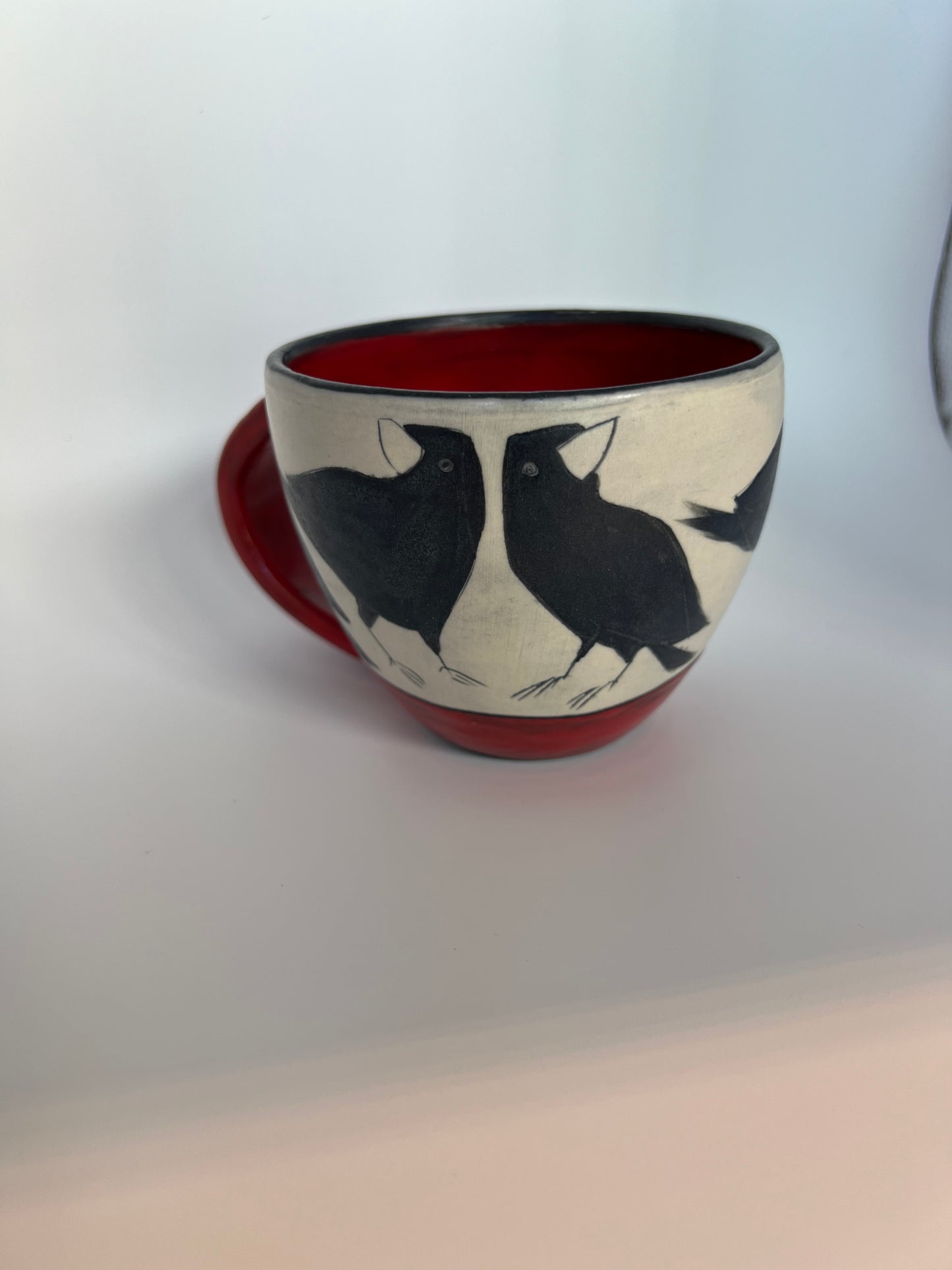 Crow on Latte cup by Sally Jaffee